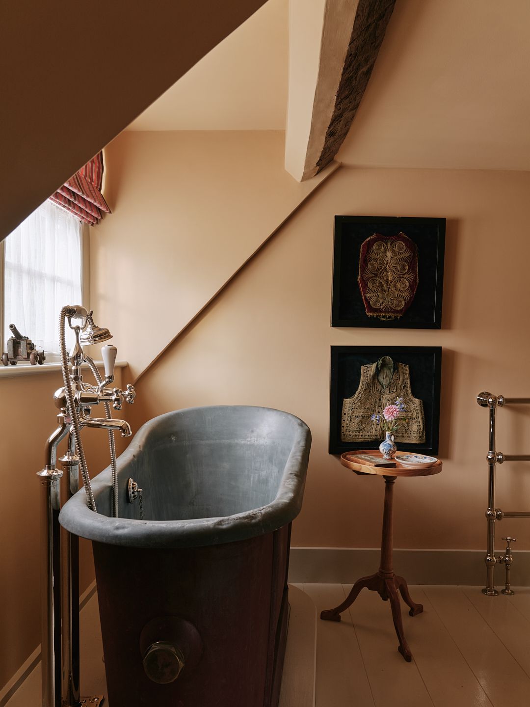 The bathroom in a Hampshire house decorated by Max Rollitt features a little stool next to the bath  the perfect perch...