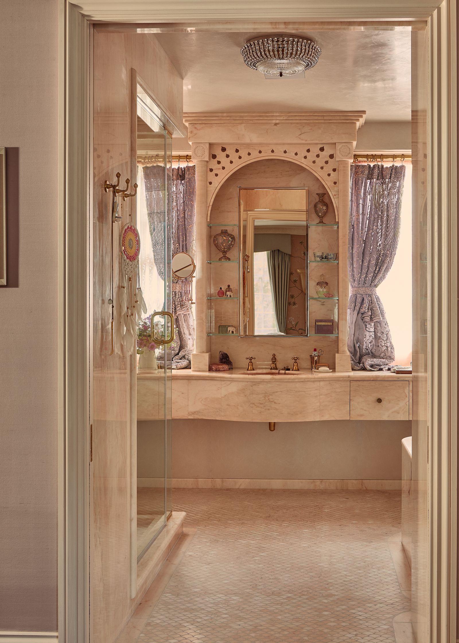 Inside Kate Mosss chic bathroom and 7 decor ideas to steal  pale pink bathroom with marble clad vanity counter placed...