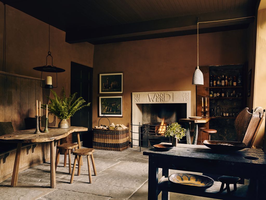 In the old servants kitchen is a Mouseman table made by Robert Thompsons Craftsmen. The stone fire surround carved with...