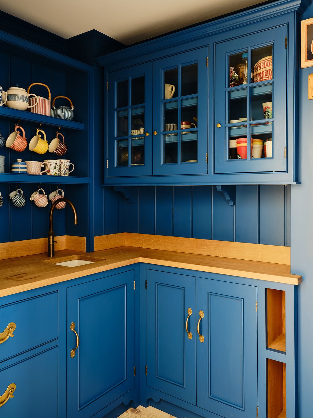The pantry is painted in ‘Deep Nanking Bluenbspby Papers  Paints.