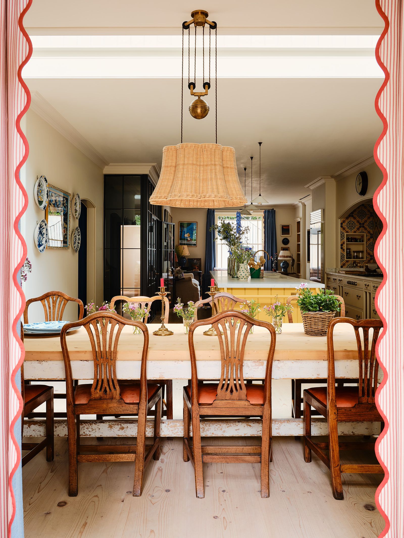 A view from the back to the front of the lowerground floor. The curtains are lined in Ian Mankin's ‘Red Ticking with...