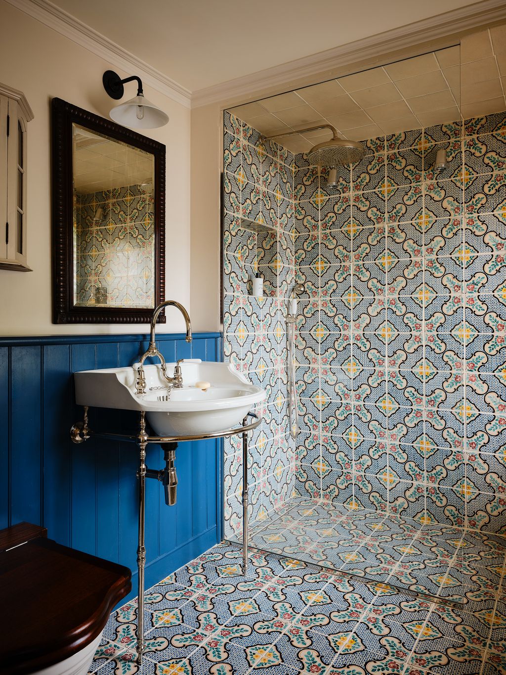 The guest bathroom features tiles designed by Serena.