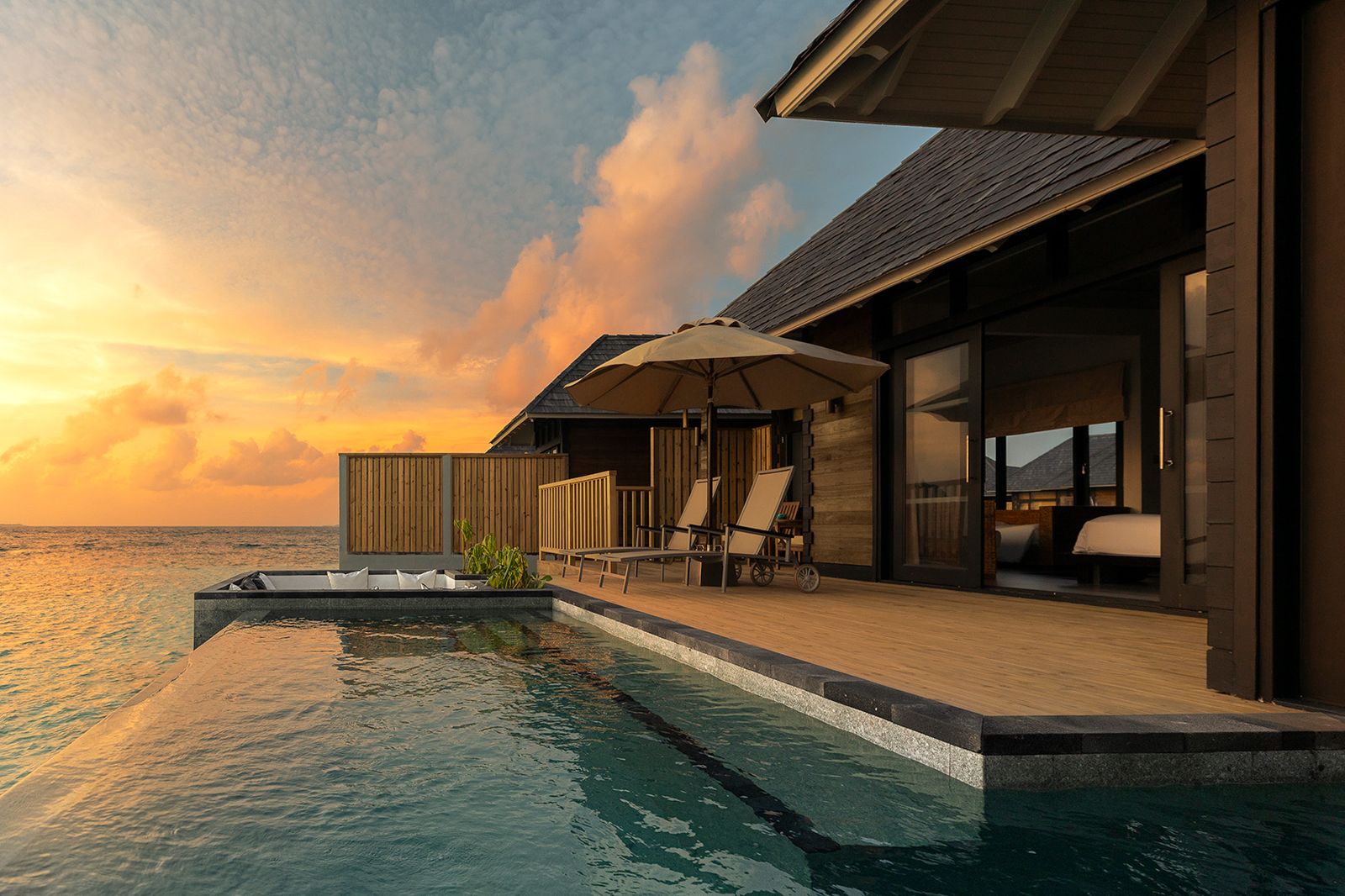 A sunset water villa with pool.