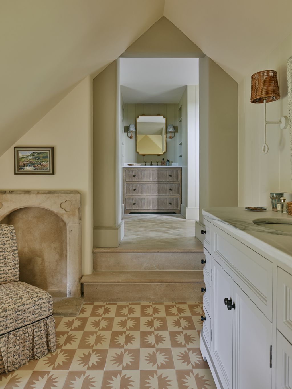The steps lead to another part of the bathroom with an extra basin.