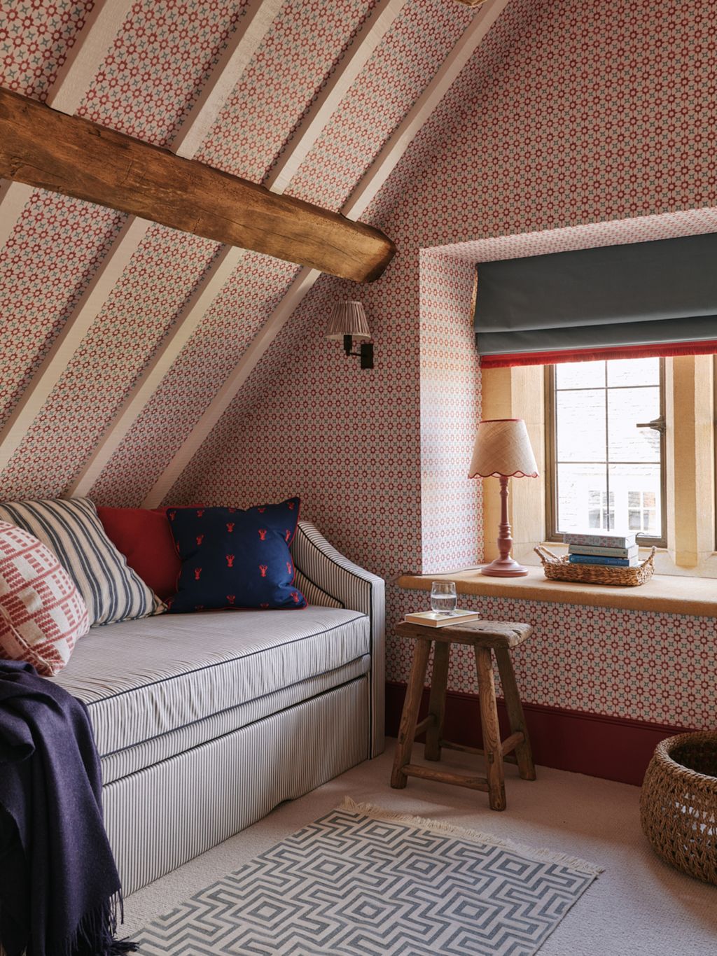 Walls in Jane Churchills redaqua ‘Tassi and a pullout daybed in Ian Mankins ‘Ticking Stripe with Samuel Sons ‘Flanders...