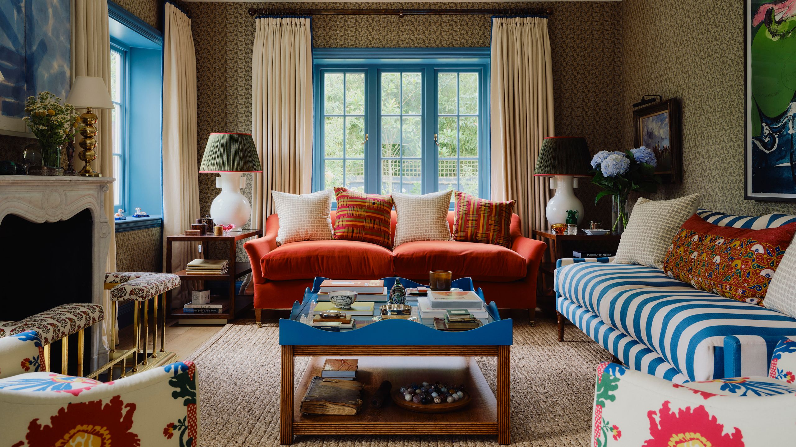 Bold colours and patterns come together in the drawing room with terracotta and green tones lifted by touches of cobalt...