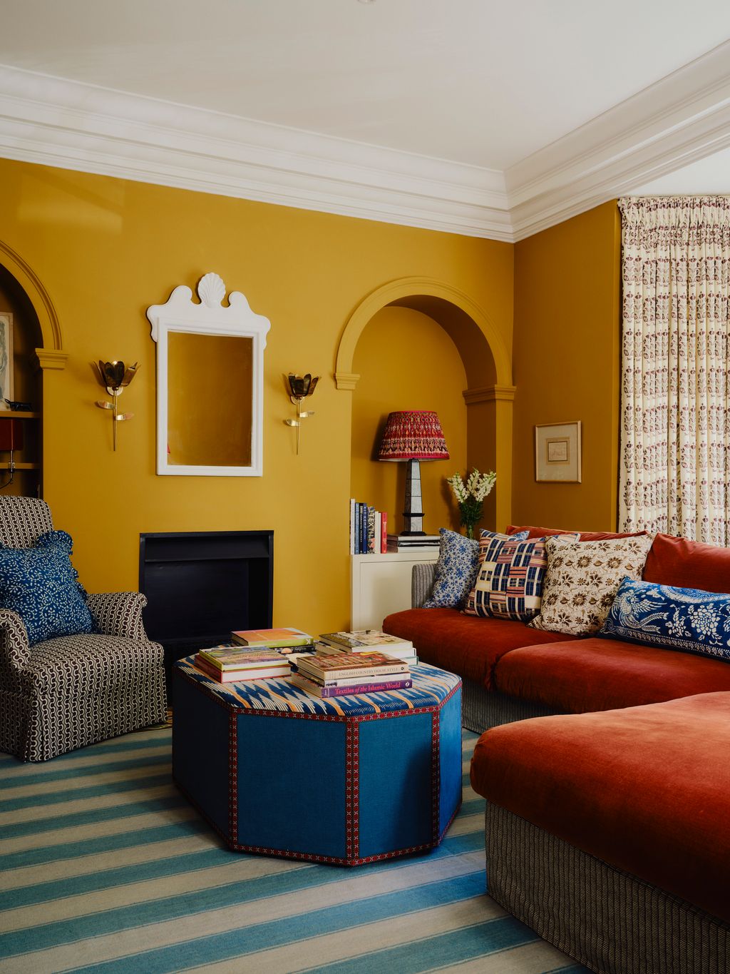 In the sitting room walls painted in Muga by Paint  Paper create a warm cocooning feel. The Lshaped sofa from Love Your...