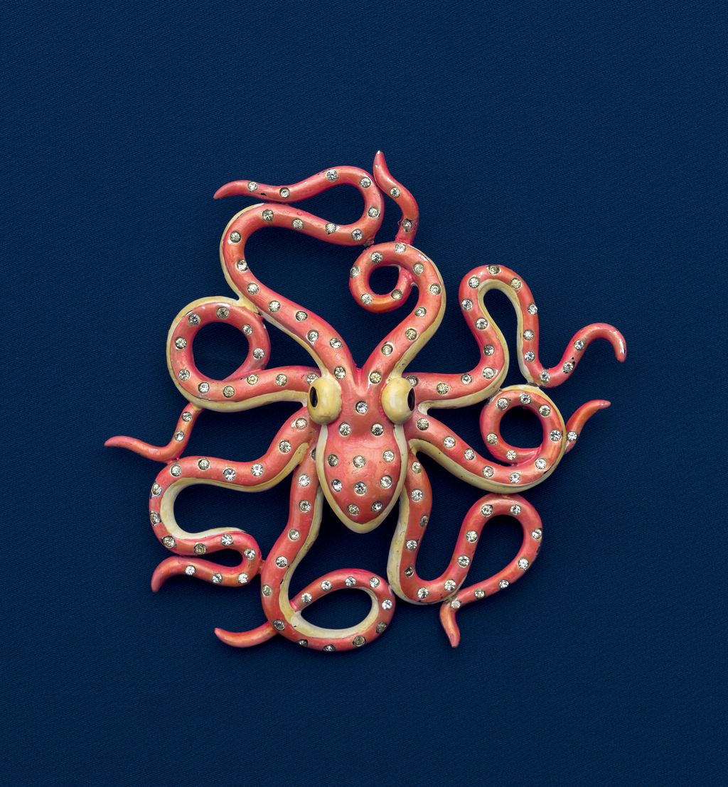 Dating from 1941 this spangled pink enamel octopus pin by Marcel Boucher is set with rhinestones on a rhodiumplated...