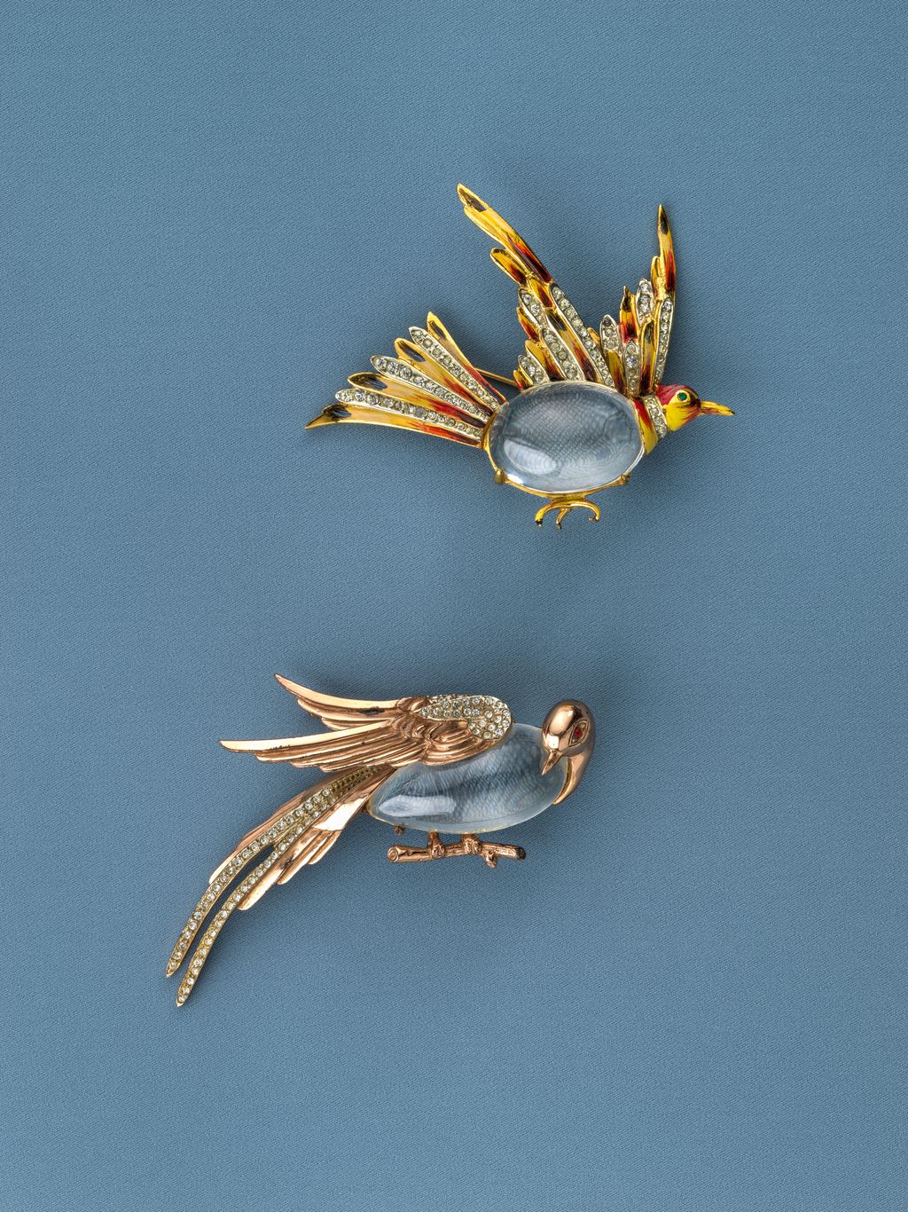 Created in 1944 by Adolph Katz for Coro these Jelly Belly bird pins depict a flying grouse and a pheasant combining...