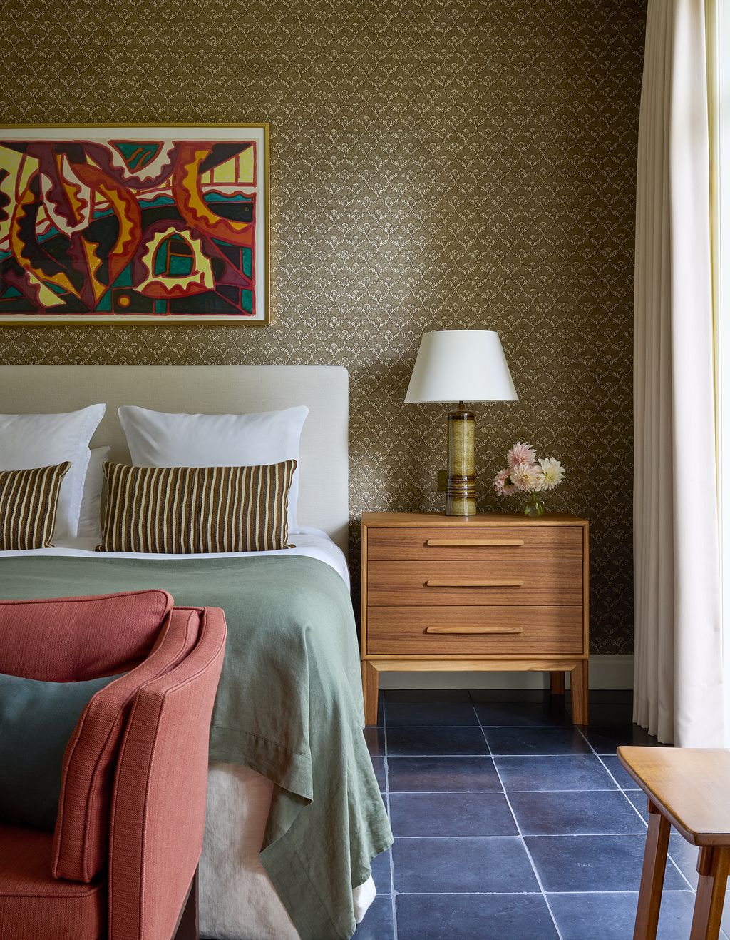 In the bedroom ‘Pattey linen from Namay Samay covers the walls. Brandons design for the bedside chests echoes a...