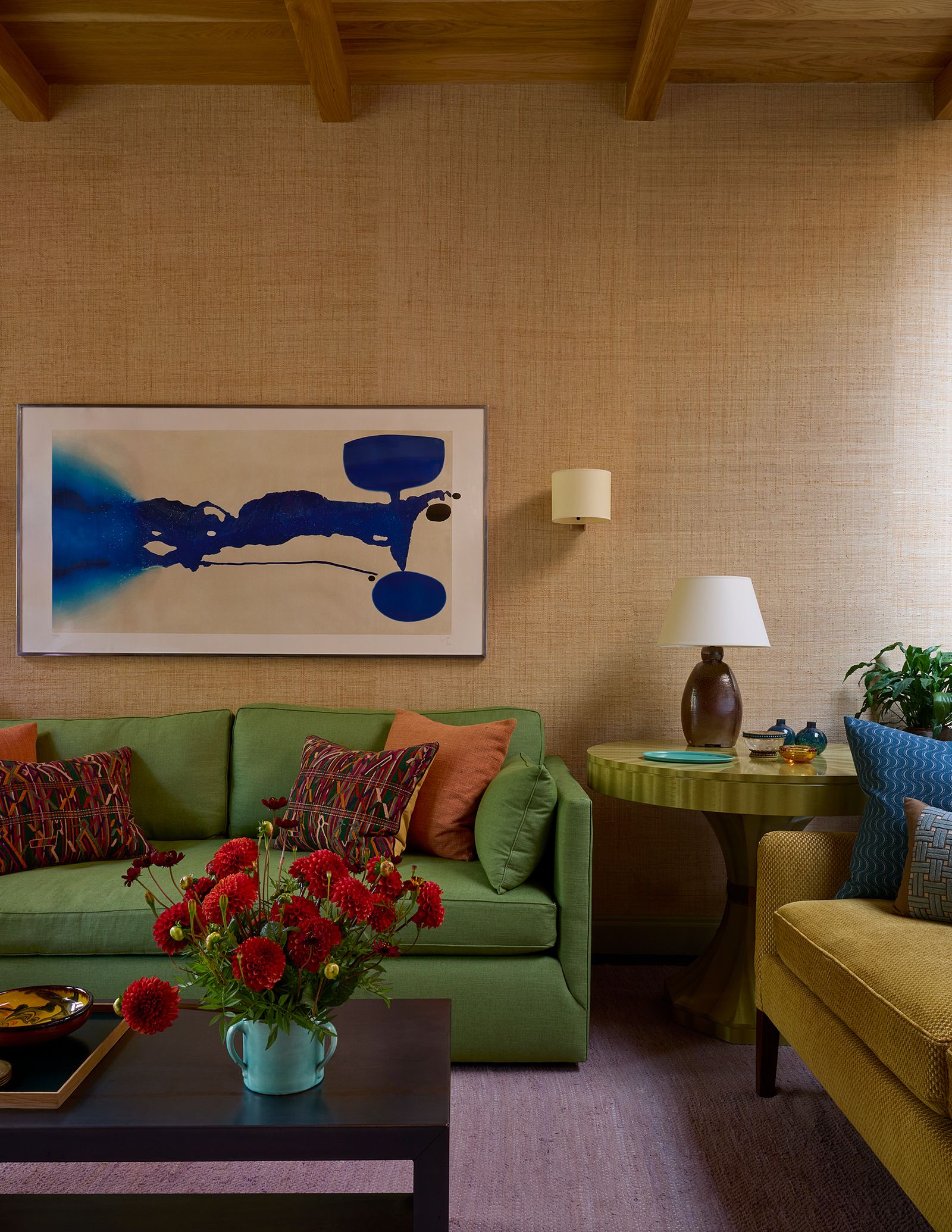 The green veneered table was designed by Brandon and is topped with a table lamp created from a Japanese pottery vase....