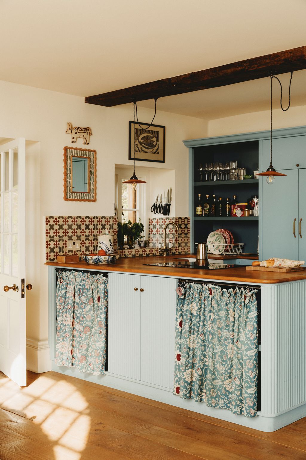 The other gatehouse Magog houses a small kitchen a family dining area and a bedroom painted in Edward Bulmers soft pink...