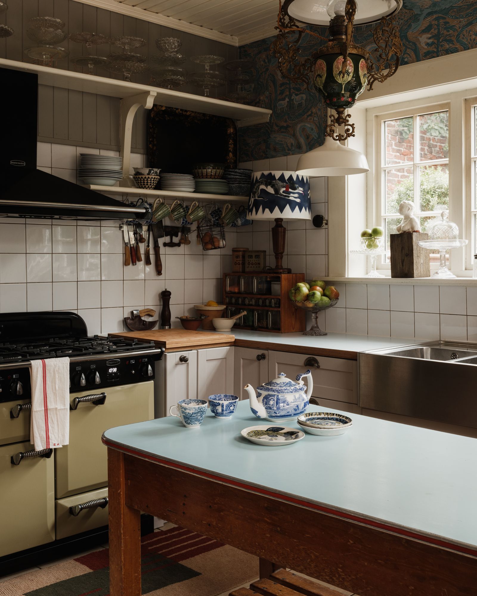 The blue Formica island was rescued from a local school that was shutting down. The lurcher lampshde was painted by Mick...