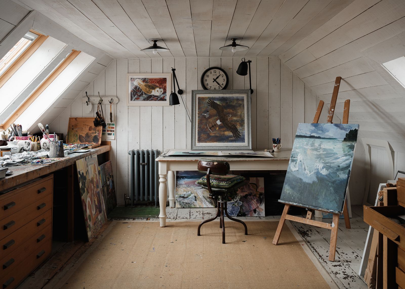 The hen harriers on the desk and the owl hanging on the wall to the left are by Mick. The paintings on the floor and the...