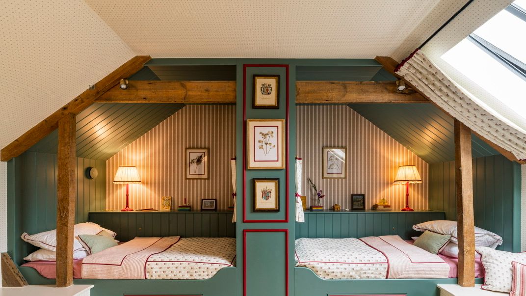 Image may contain: Indoors, Interior Design, Furniture, Art, Painting, Bed, Bedroom, Room, Lamp, Architecture, and Building