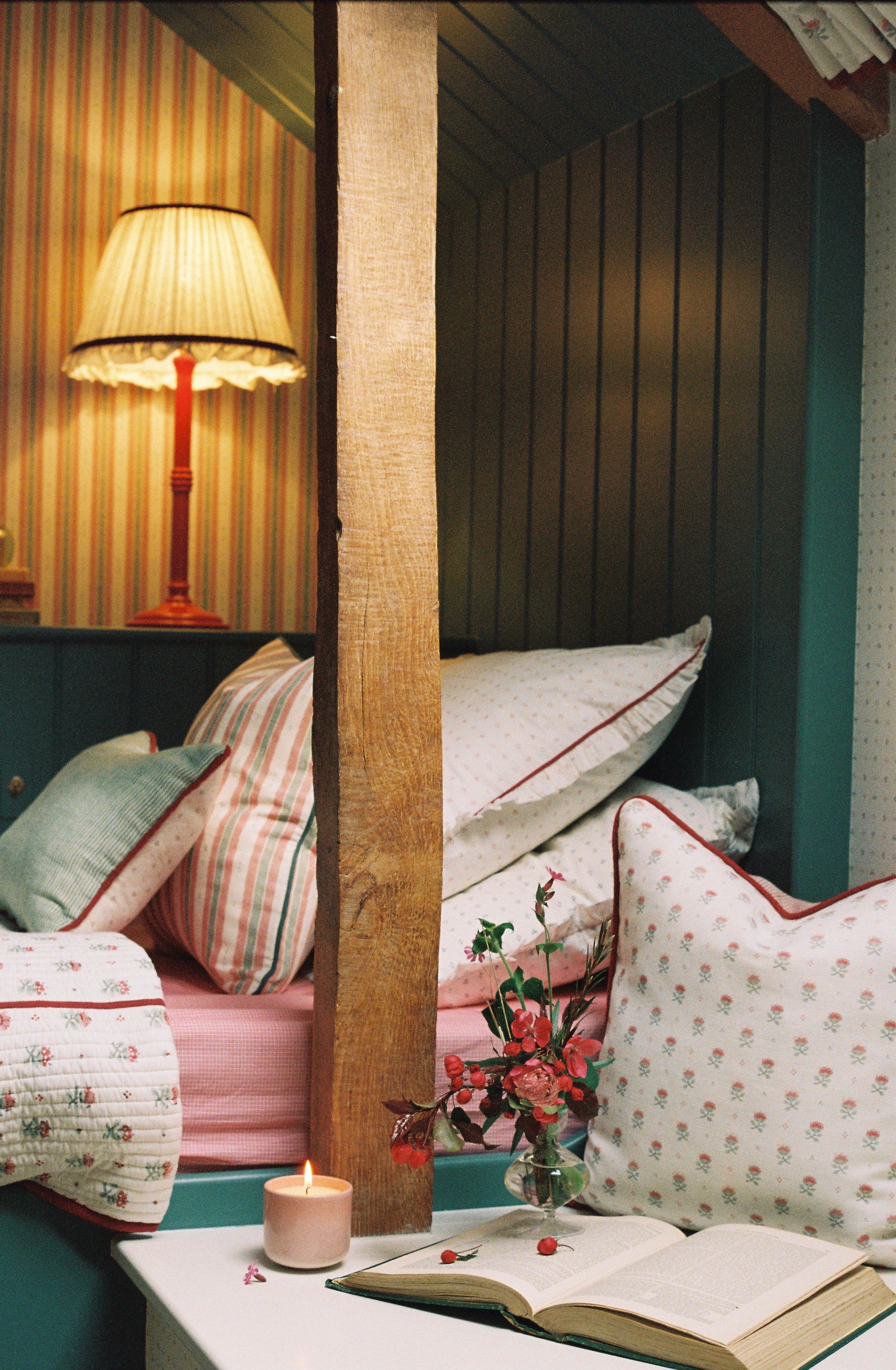 Image may contain: Indoors, Interior Design, Cushion, Home Decor, Lamp, Pillow, and Wood Panels