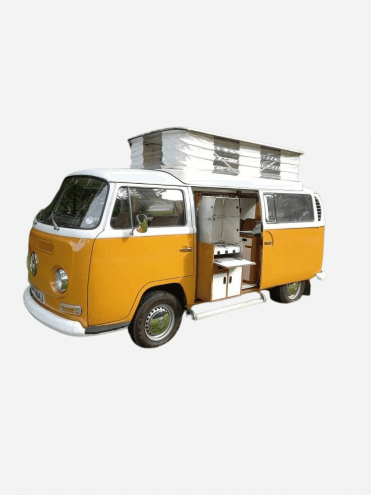 Image may contain: Caravan, Transportation, Van, Vehicle, Car, Machine, and Wheel