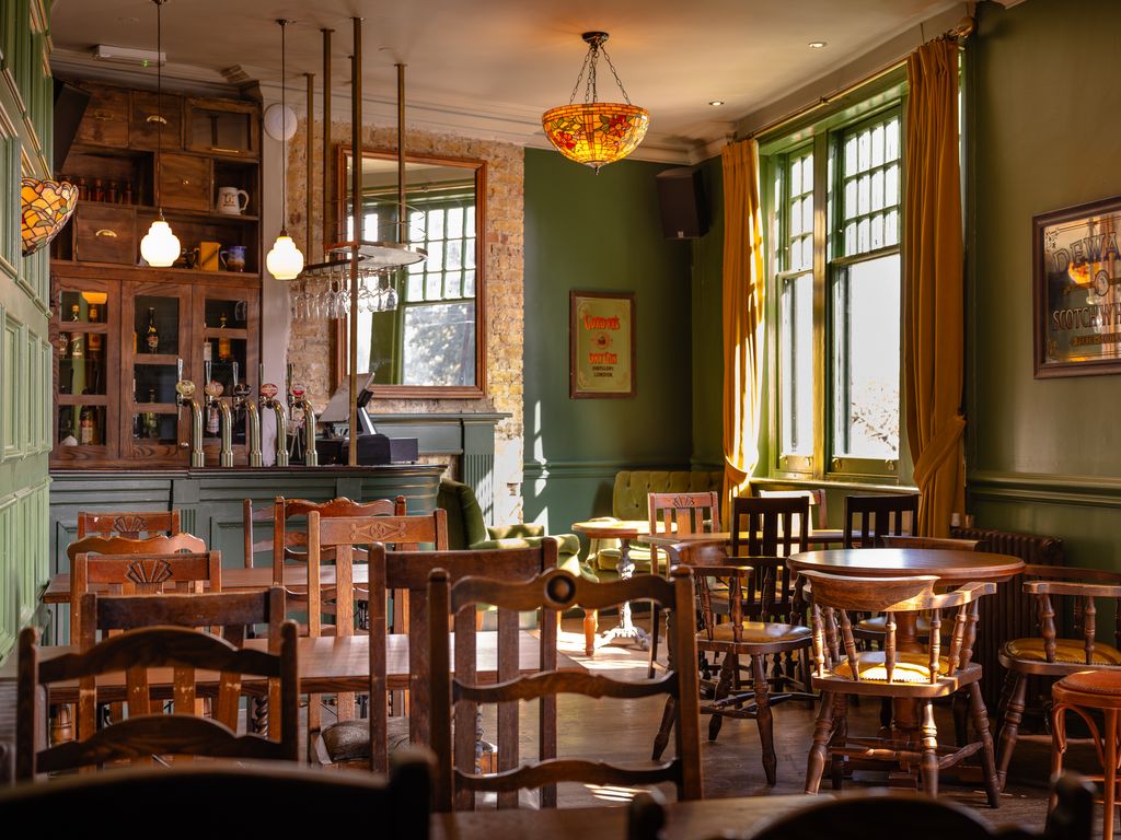 Image may contain Architecture Building Dining Room Dining Table Furniture Indoors Room Table Cafe and Restaurant