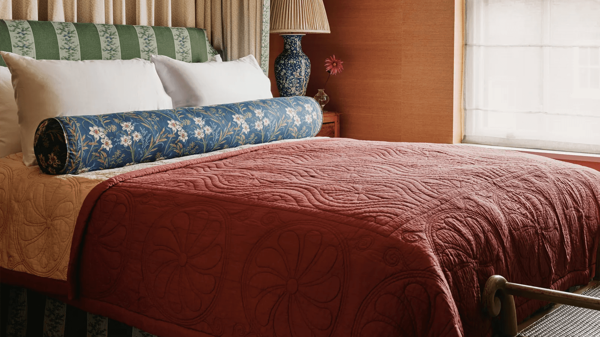 Image may contain Indoors Interior Design Furniture Bed Lamp Cushion and Home Decor