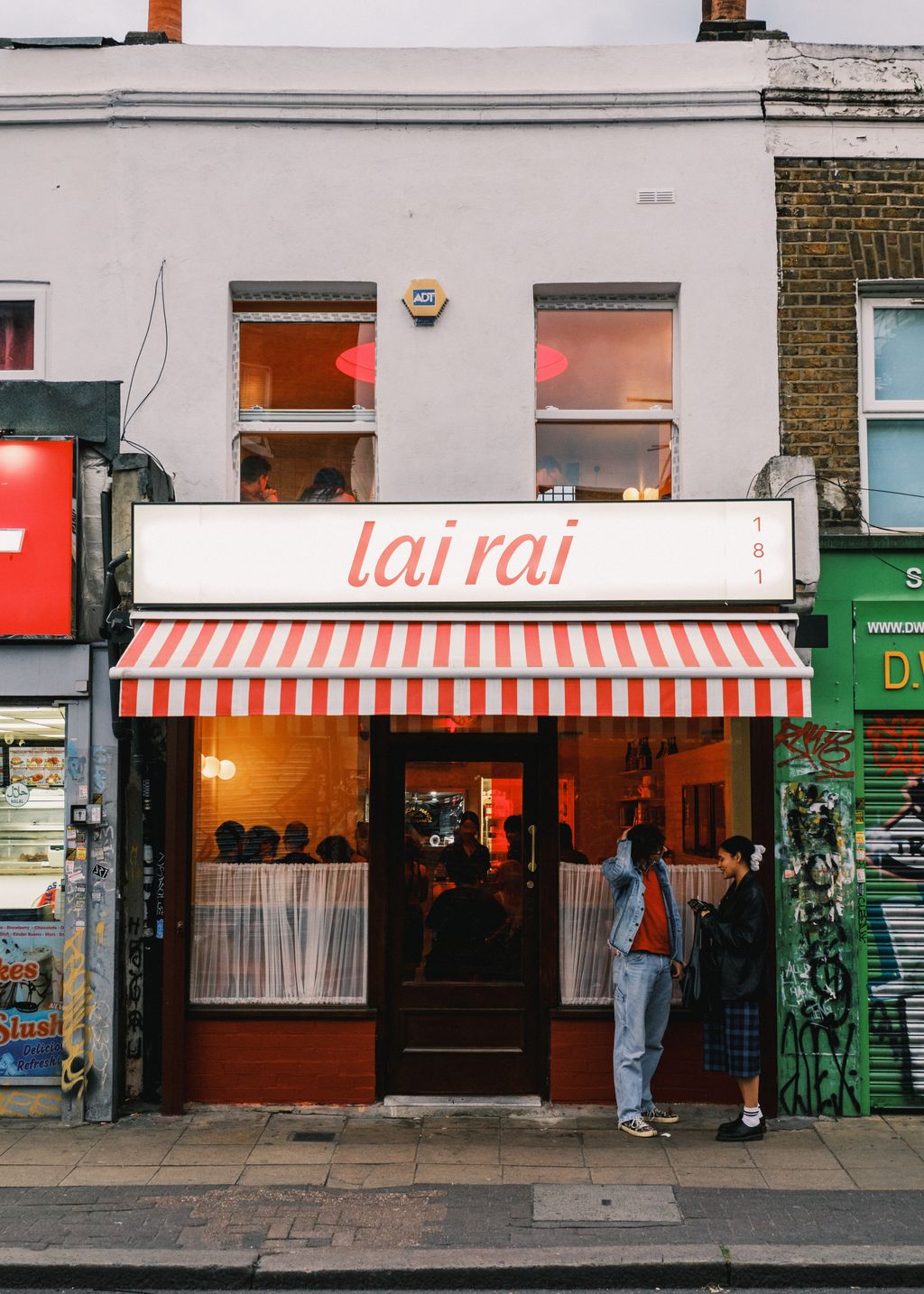 Image may contain Architecture Building Urban Person Awning Canopy Cafe Indoors Restaurant Clothing and Footwear