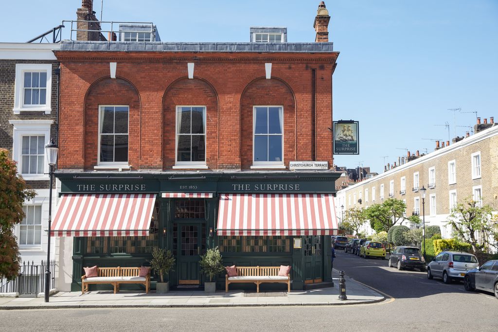 Image may contain Awning Canopy Plant City Urban Car Transportation Vehicle Fire Hydrant Hydrant and Person