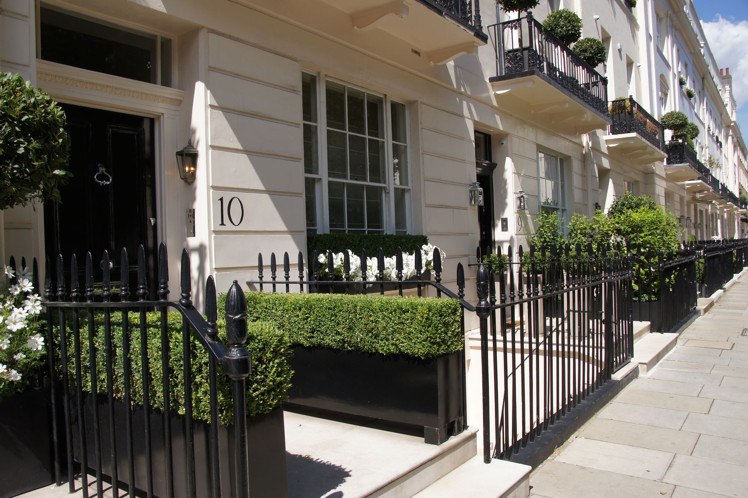 Image may contain: Fence, Hedge, Plant, Architecture, Building, and Housing