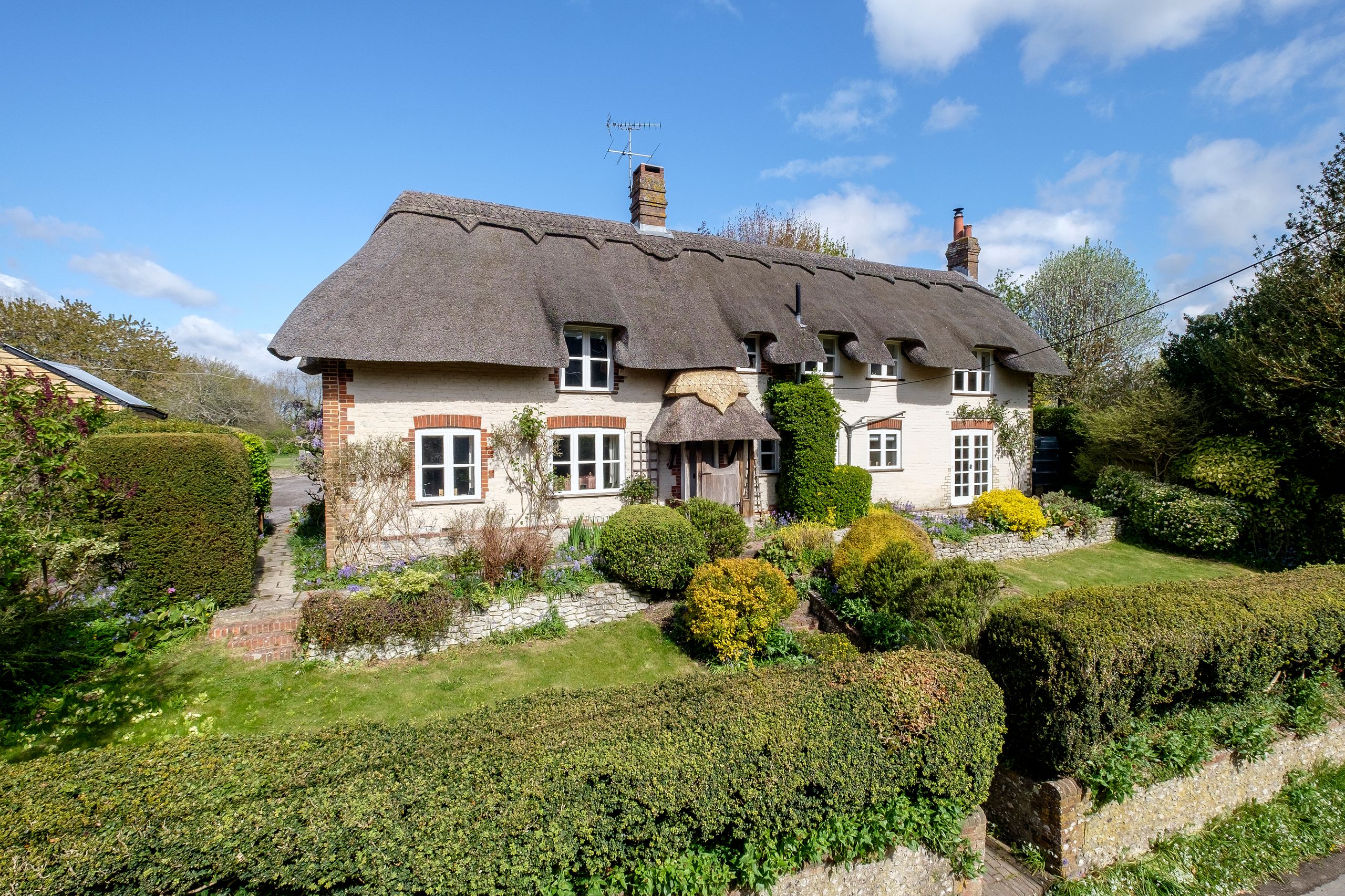 Image may contain: Architecture, Building, Cottage, House, Housing, and Manor