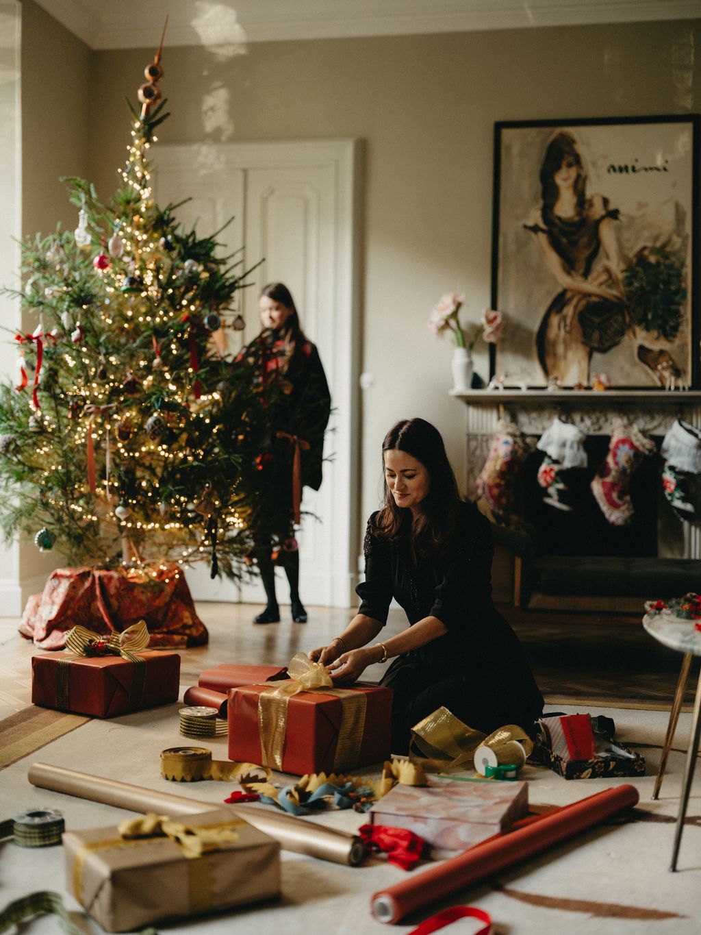 Image may contain Darina Al Joundi Adult Person Festival Christmas Christmas Decorations and Christmas Tree