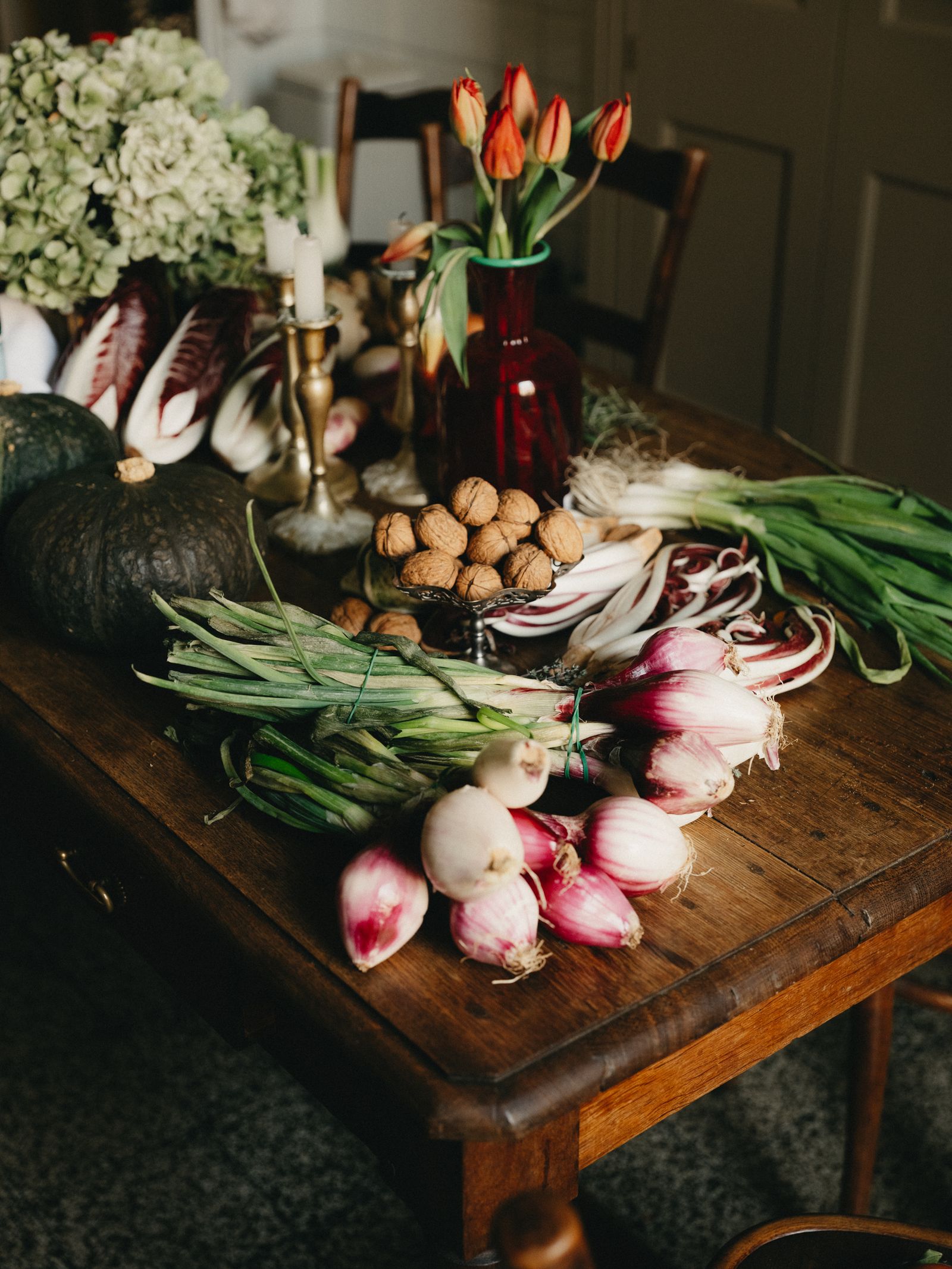 Image may contain Food Produce Candle Desk Furniture Table and Person