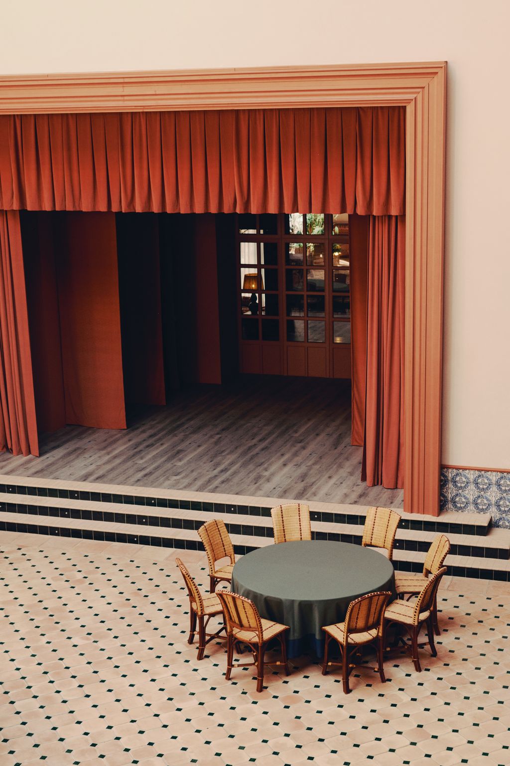 Image may contain Indoors Interior Design Chair Furniture Door and Table