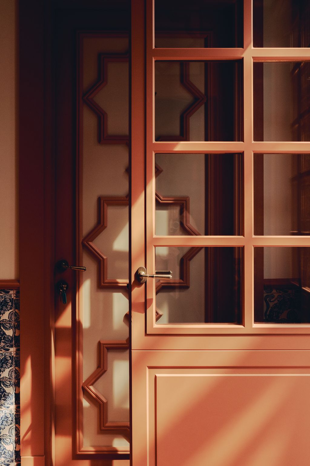 Image may contain Door Indoors Interior Design Architecture Building Housing House Hardwood Stained Wood and Wood