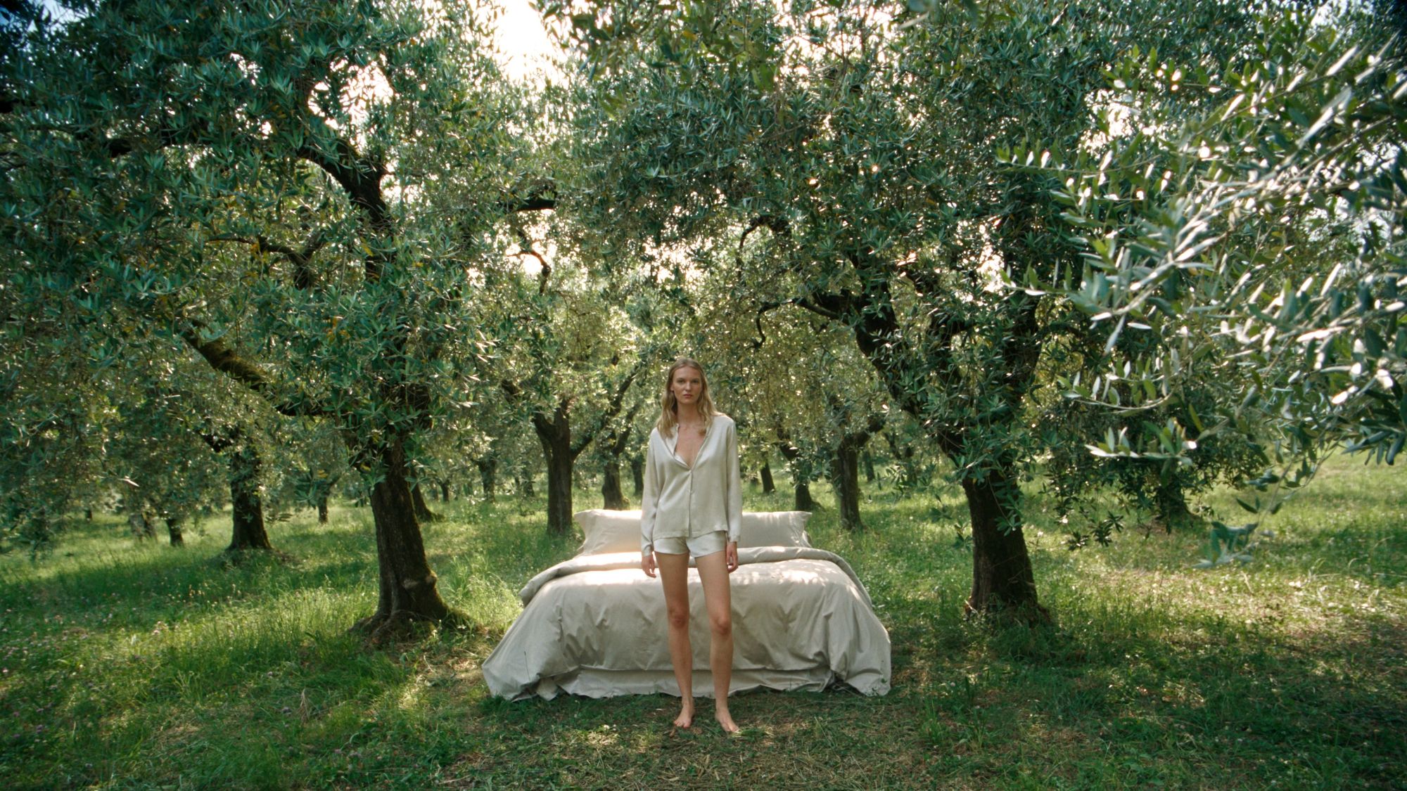 Image may contain: Irena Škorić, Plant, Vegetation, Person, Sitting, Adult, Standing, Grass, Tree, Land, Nature, and Outdoors