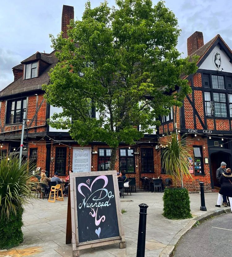 Image may contain Architecture Building Housing Person House Blackboard Row House Car Transportation and Vehicle