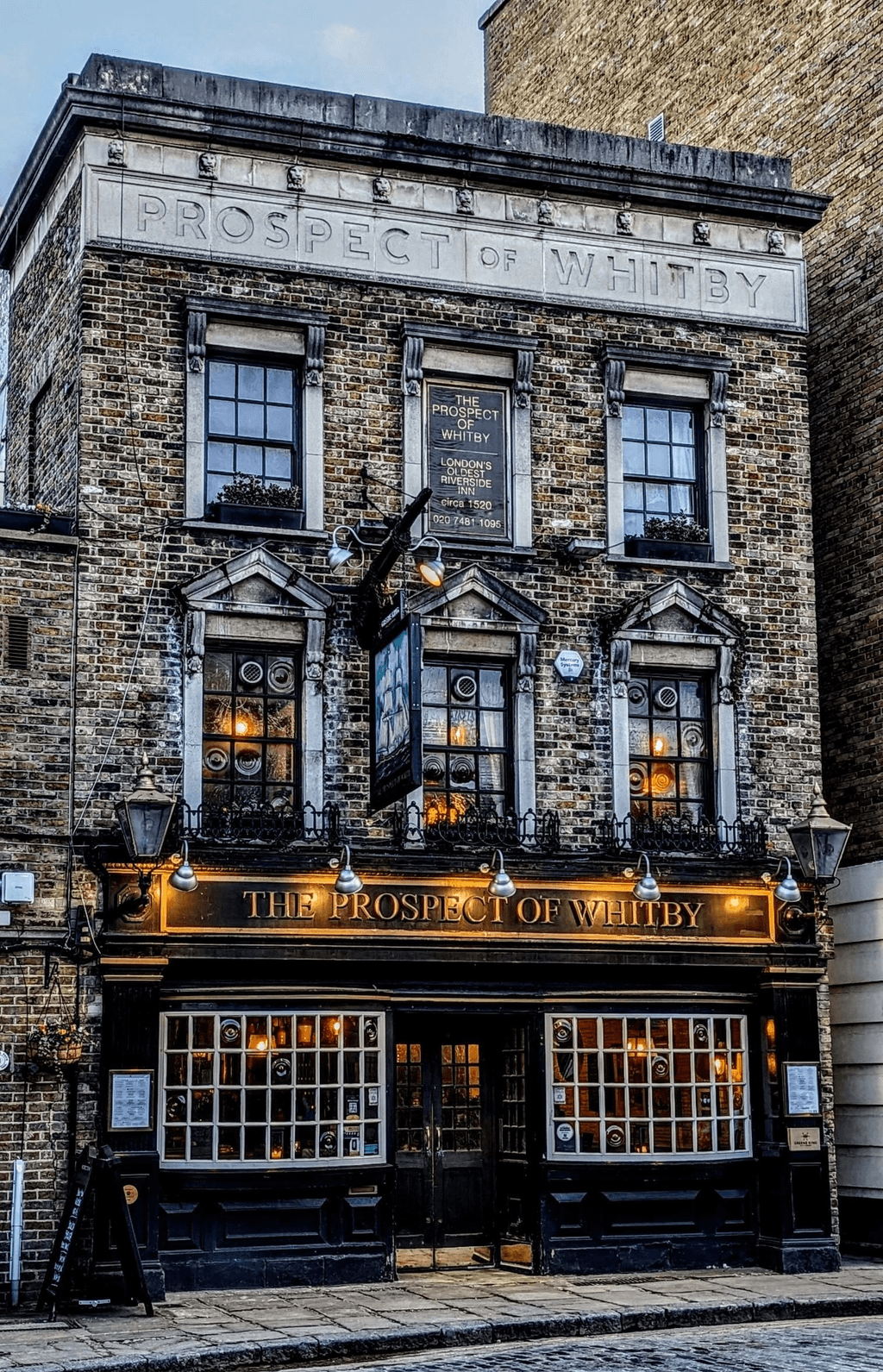 Image may contain City Architecture Building Urban Brick Window Bay Window Hotel and Pub