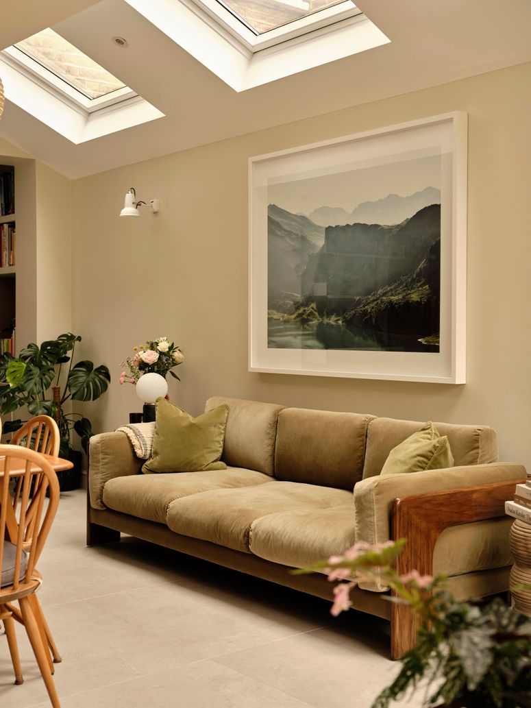 Image may contain: Couch, Furniture, Architecture, Building, Indoors, Living Room, Room, Window, Art, and Painting