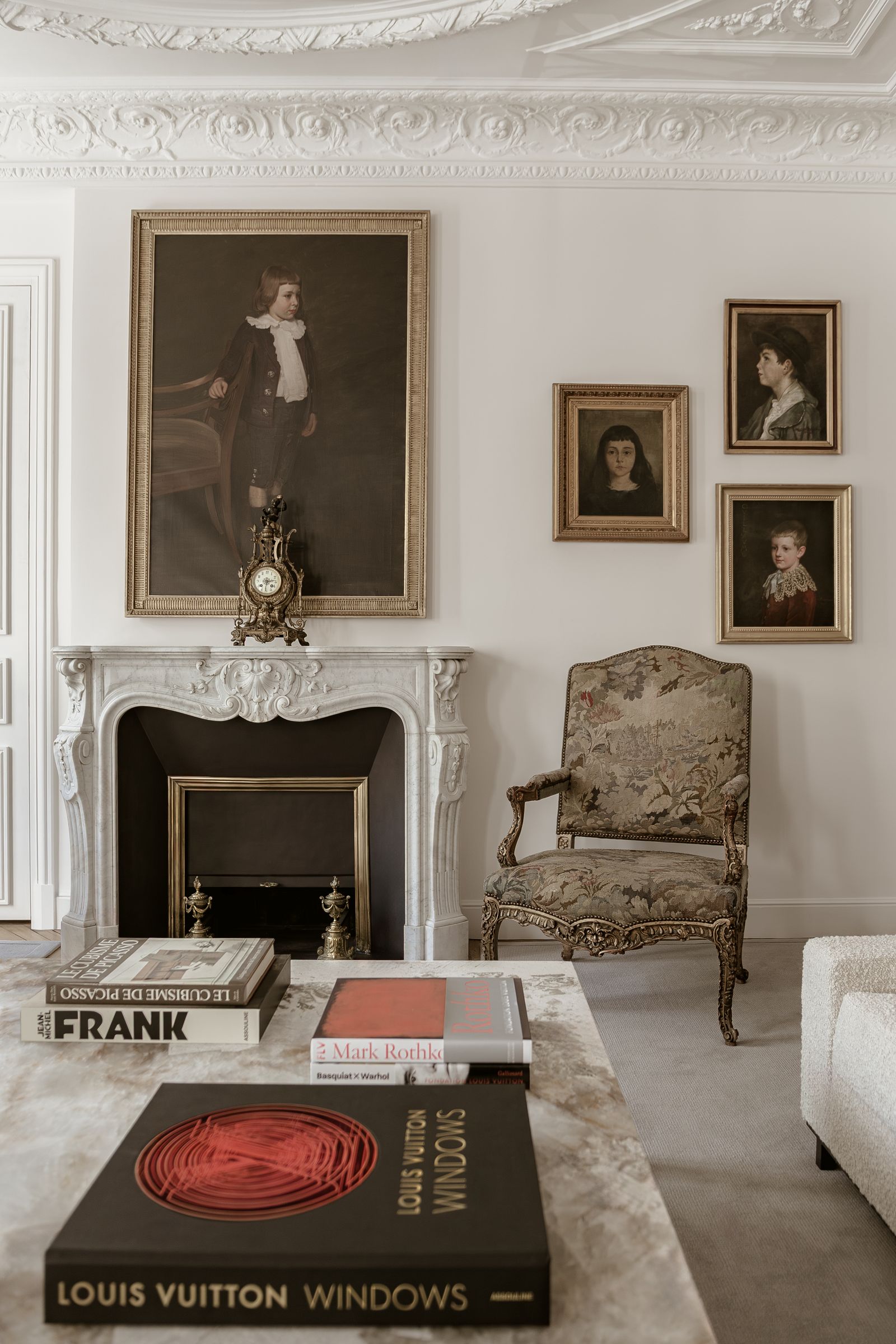On the mantelpiece in the living room of Allen Kirschs Haussmannian apartment in Paris a bronze clock in the shape of a...