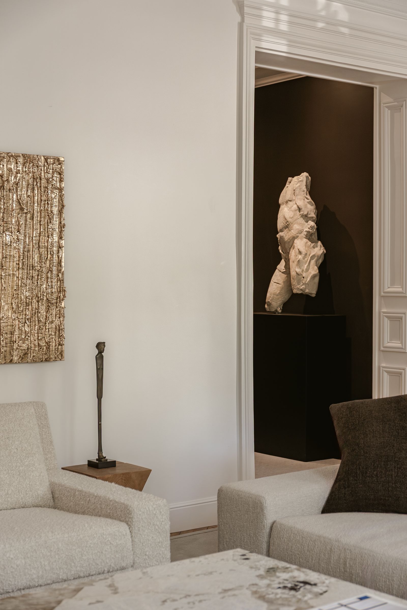 In the entrance hall a fragment of a plaster torso found at the Paris flea market is on display