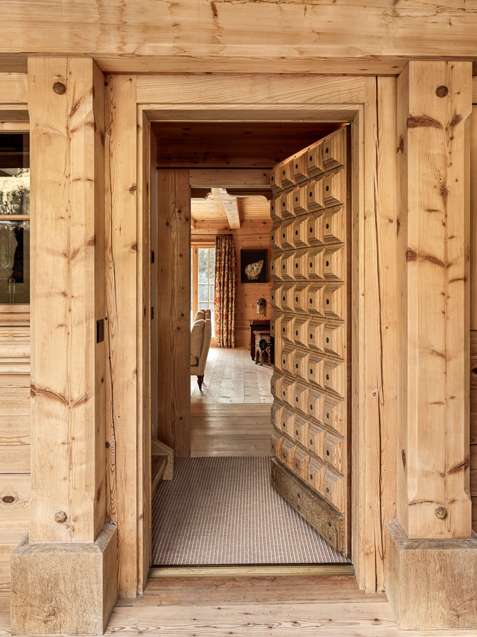 Image may contain Indoors Interior Design Wood Wood Panels and Door