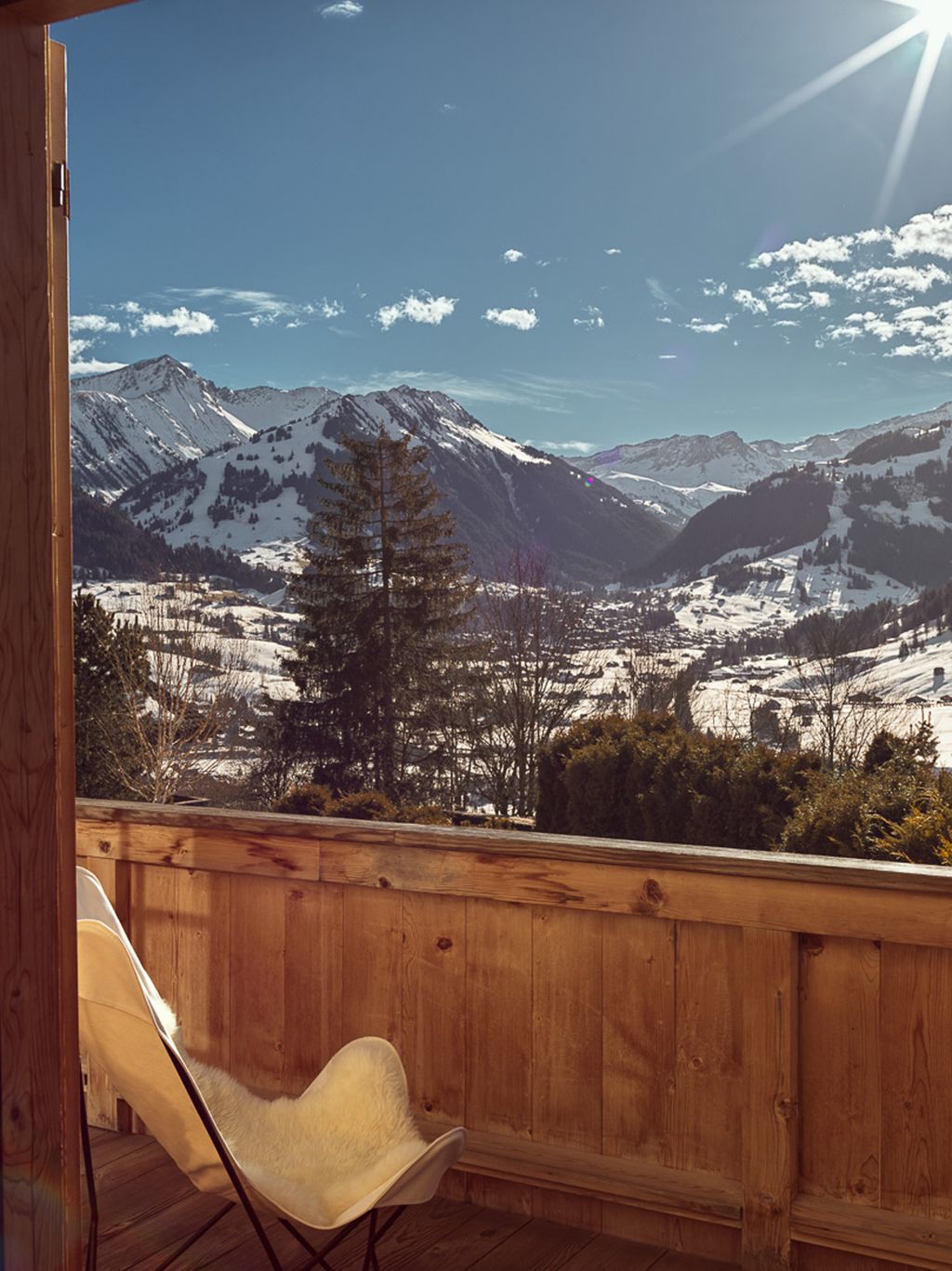 Image may contain Indoors Interior Design Architecture Balcony Building Nature Outdoors Scenery Wood and Mountain