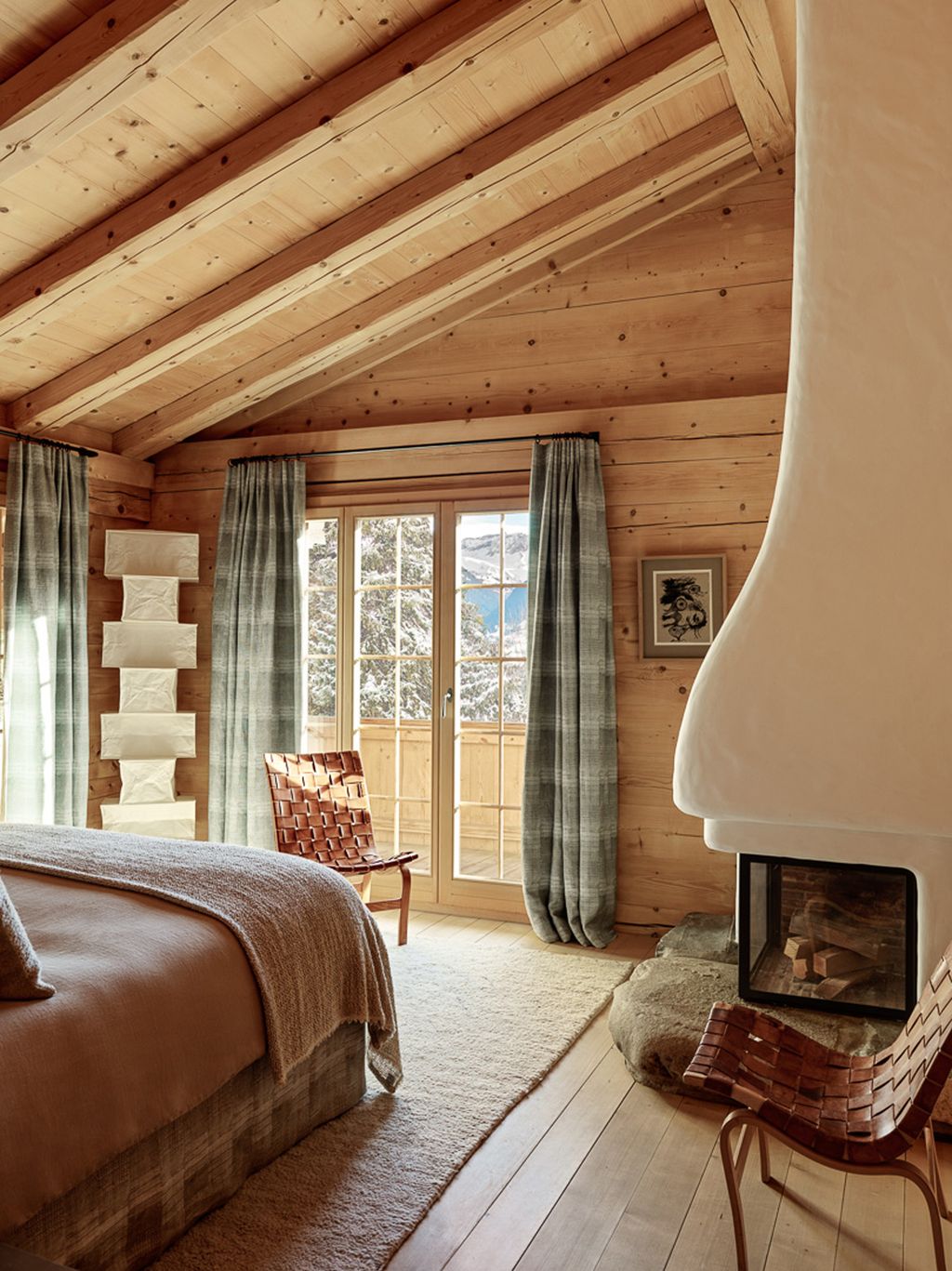 Image may contain Indoors Interior Design Wood Hardwood Stained Wood Fireplace Architecture Building and Housing