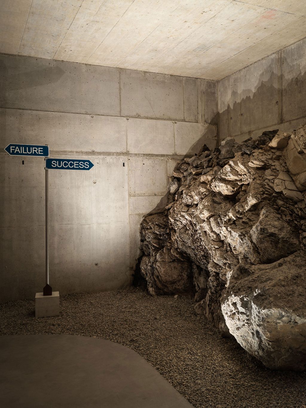 Image may contain Rock Road Sign Sign and Symbol