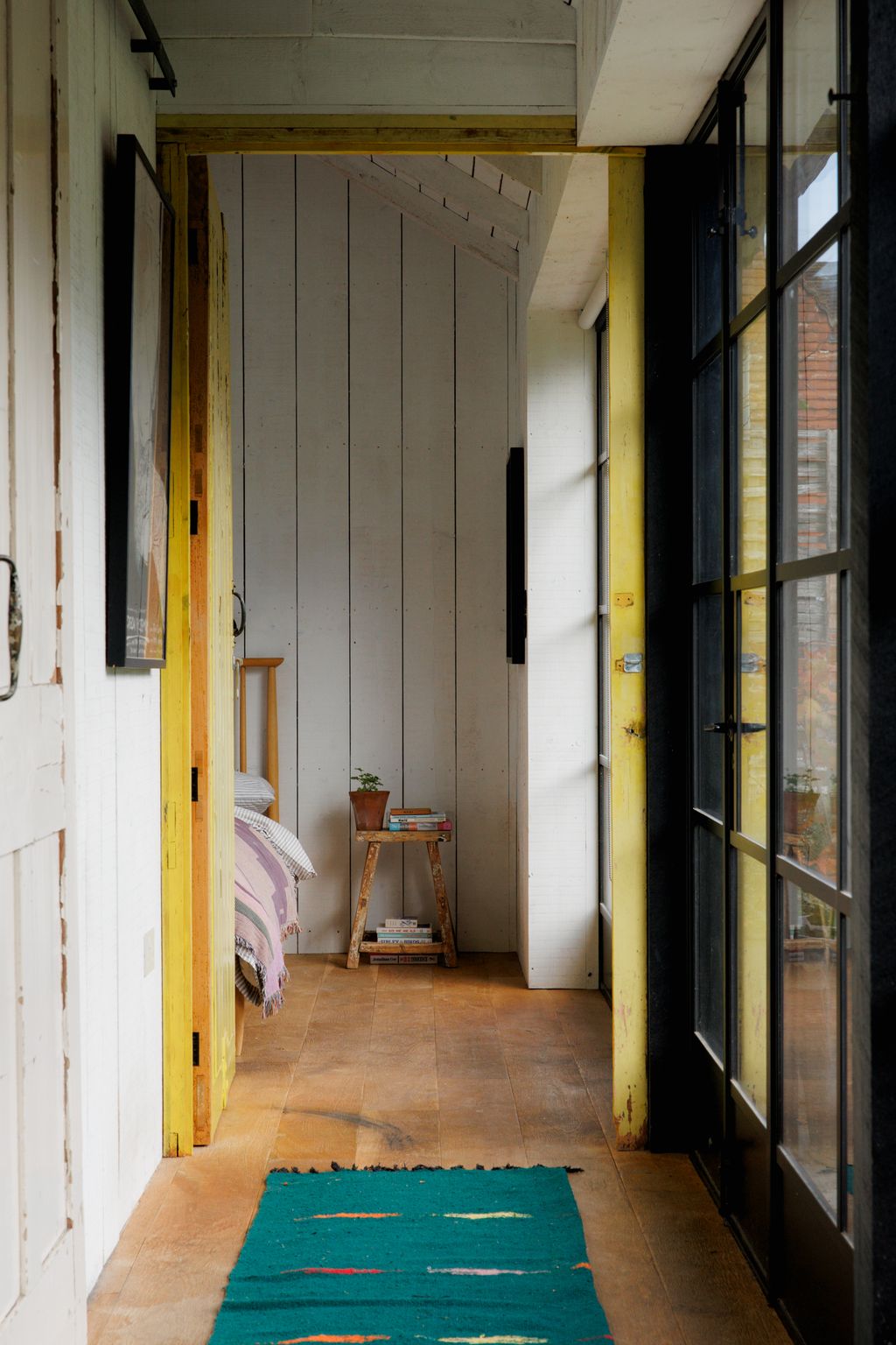 Image may contain Indoors Interior Design Door Plant Floor Architecture Building and Housing