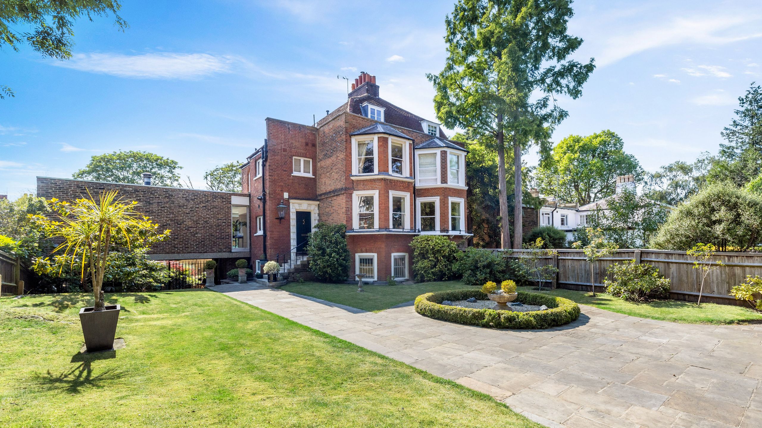 Image may contain: Architecture, Building, Housing, House, Manor, and Plant