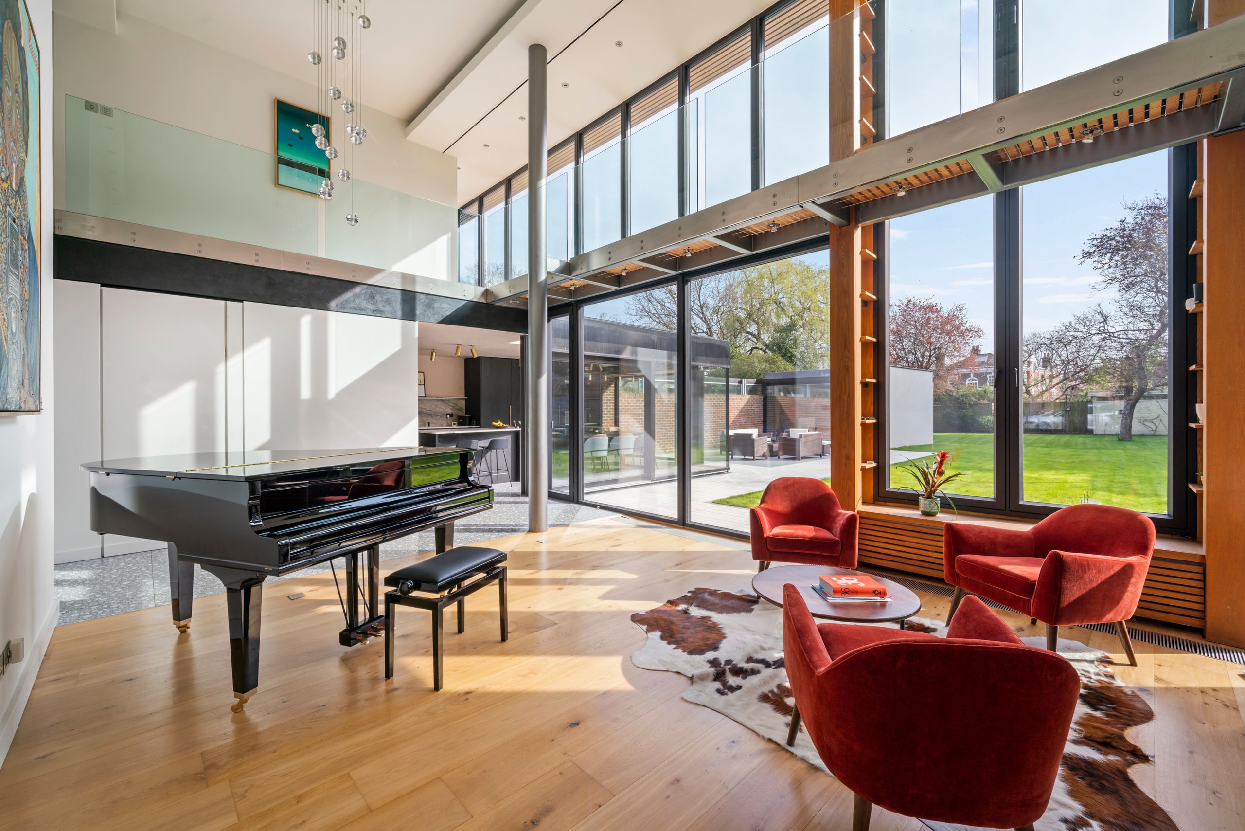 Image may contain: Indoors, Interior Design, Floor, Door, Keyboard, Musical Instrument, Piano, Home Decor, and Chair