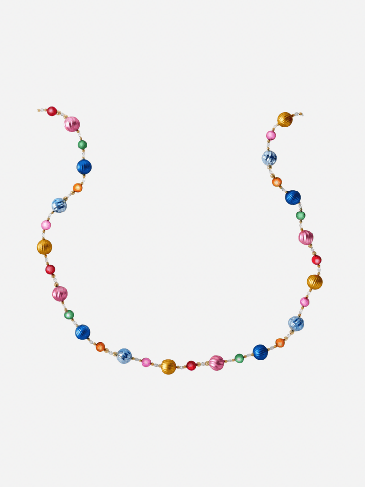 Image may contain: Accessories, Jewelry, Necklace, Bead, Bead Necklace, Ornament, and Bracelet