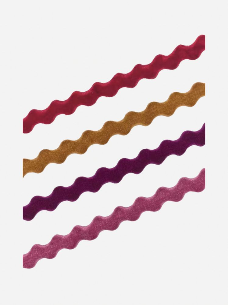 Image may contain: Home Decor, Smoke Pipe, and Rug