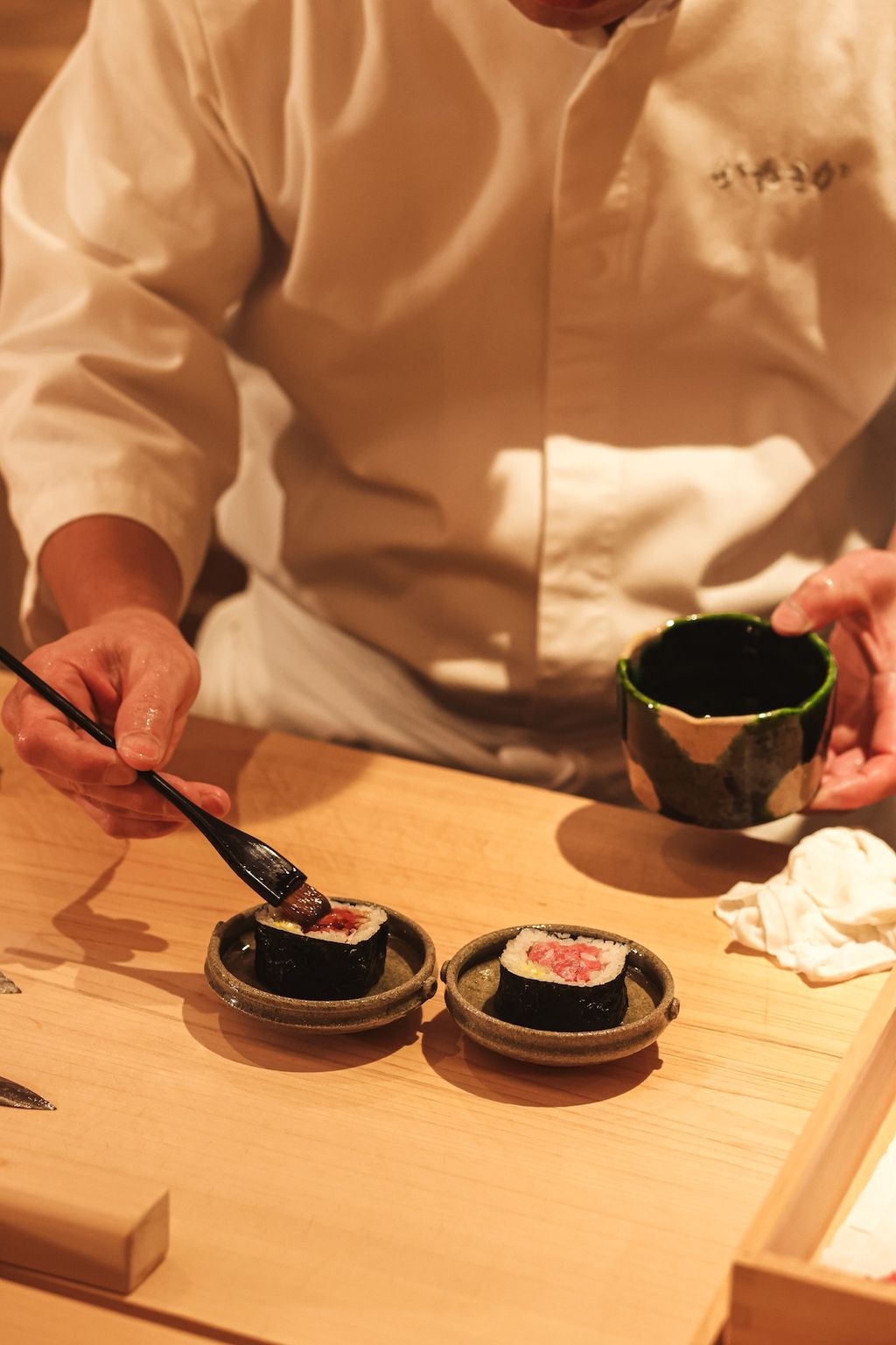 Image may contain Dish Food Meal Food Presentation Adult Person Brush Device Tool Cup Chopsticks and Baby