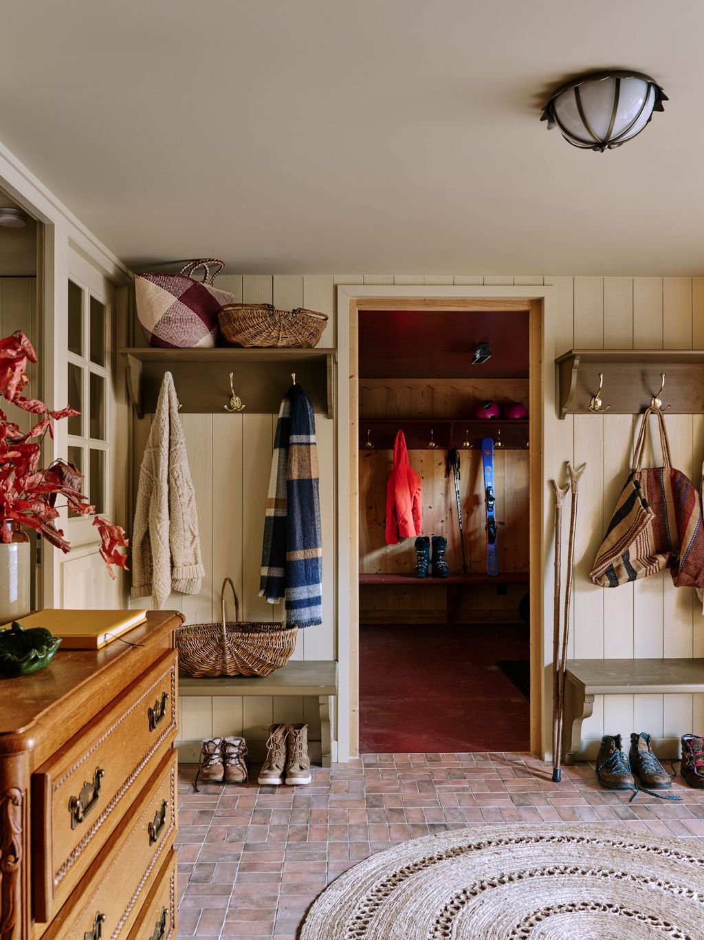 Image may contain Furniture Dressing Room Indoors Room Home Decor Rug Accessories Bag Handbag and Clothing