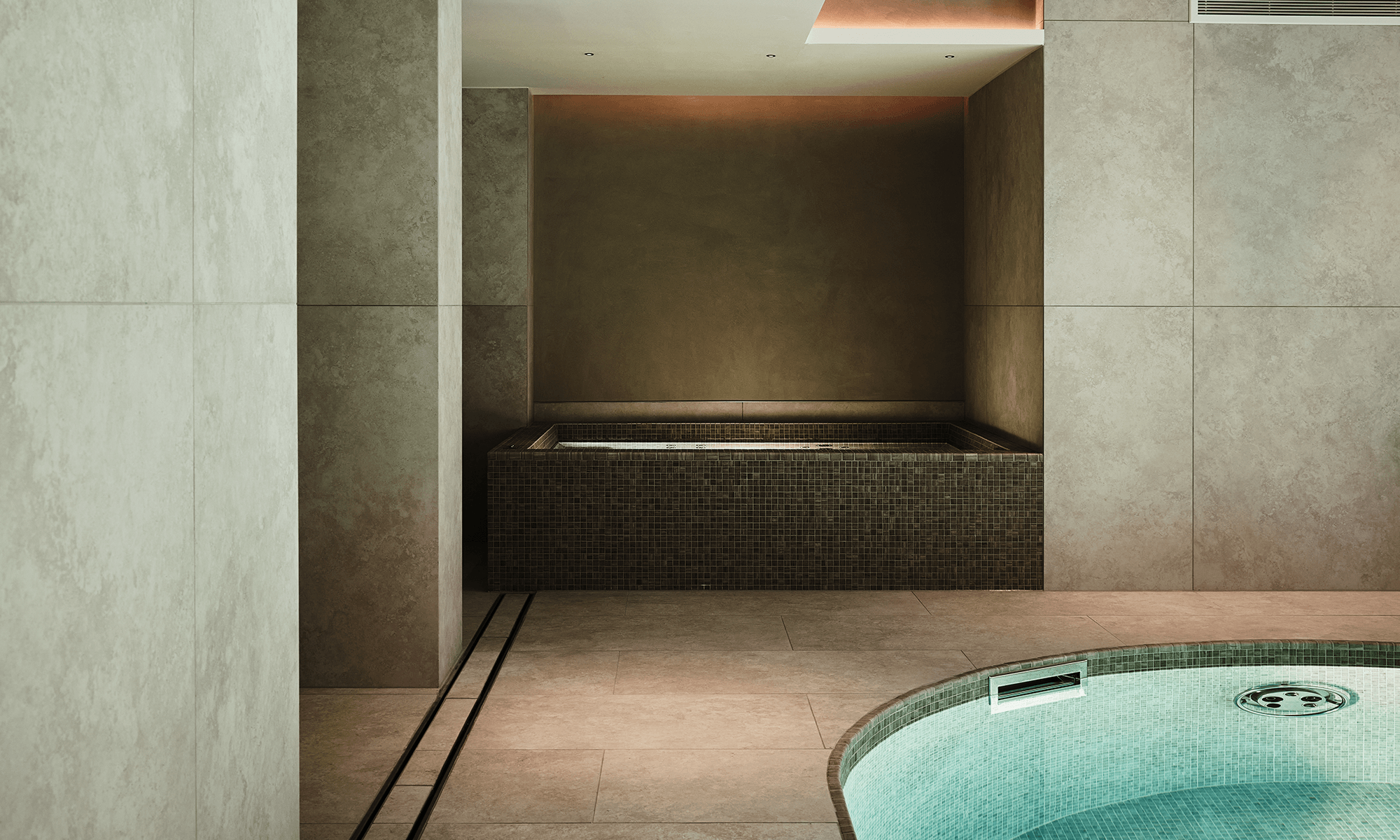 Image may contain: Tub, Floor, Flooring, Architecture, Building, Bathing, Hot Tub, Indoors, Interior Design, and Bathtub