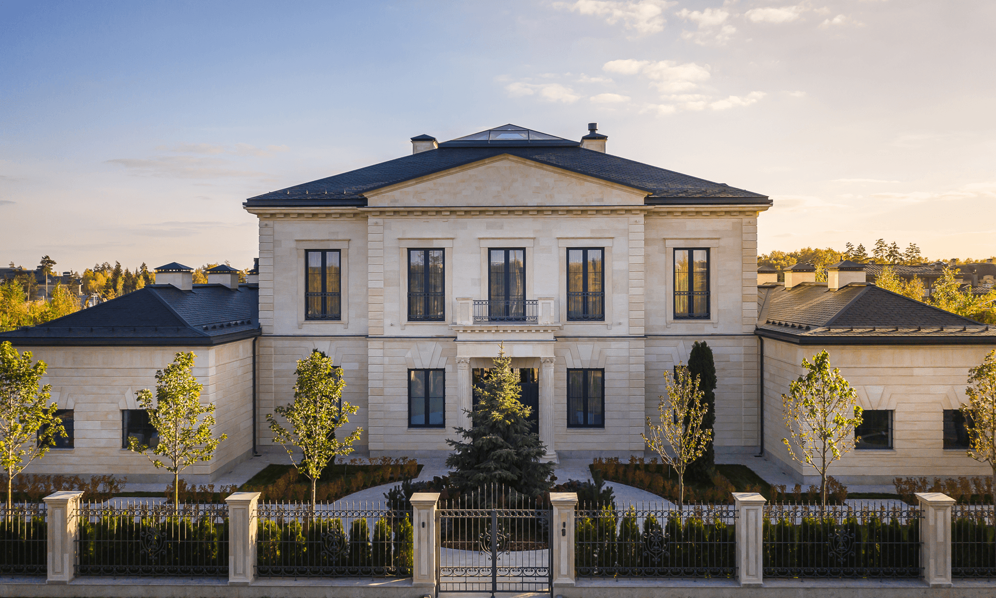 Image may contain: Architecture, Building, Housing, Fence, and House